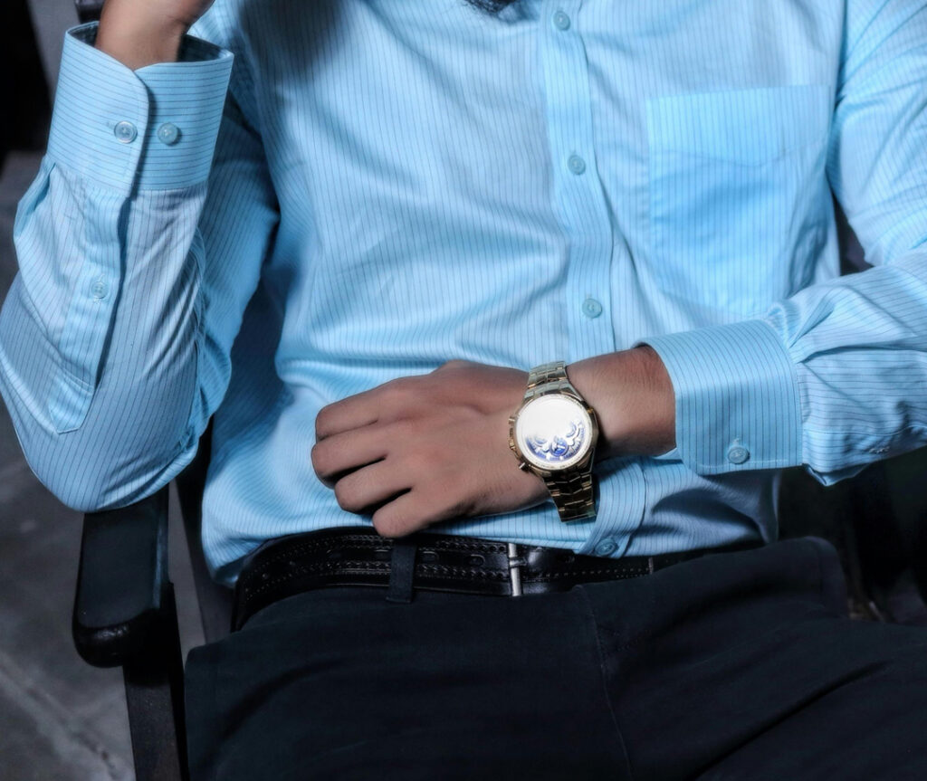 Man in smart shirt wearing a Richard Mille watch